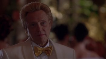 Movie still from “The Stepford Wives” (2004), directed by Frank Oz – An older man in a white suit and yellow bow tie; Close Up shot, Low angle