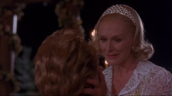 Movie still from “The Stepford Wives” (2004), directed by Frank Oz – A woman wearing a tiara looking at another woman; Close Up shot, Over the shoulder angle