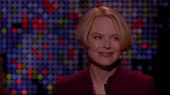 Movie still from “The Stepford Wives” (2004), directed by Frank Oz – A person with blonde hair; Close Up shot, Over the shoulder angle