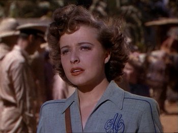 Movie still from “The Story of Dr. Wassell” (1944), directed by Cecil B. DeMille – A person wearing a jacket; Close Up shot, Over the shoulder angle