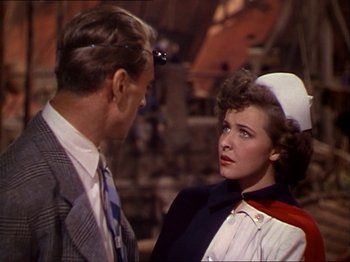 Movie still from “The Story of Dr. Wassell” (1944), directed by Cecil B. DeMille – A man and a woman talking to each other; Medium shot, Over the shoulder angle