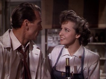 Movie still from “The Story of Dr. Wassell” (1944), directed by Cecil B. DeMille – A man and a woman are talking to each other; Close Up shot, Over the shoulder angle