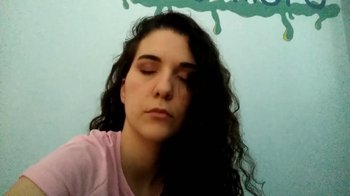 Movie still from “The Story of Film: A New Generation” (2021), directed by Mark Cousins – A woman with her eyes closed with her hair blowing in the wind; Close Up shot, High angle
