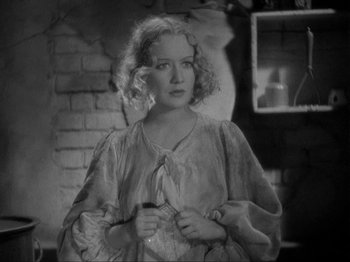 Movie still from “The Story of Temple Drake” (1933), directed by Stephen Roberts – An old photo of a woman holding a knife; Close Up shot, High angle