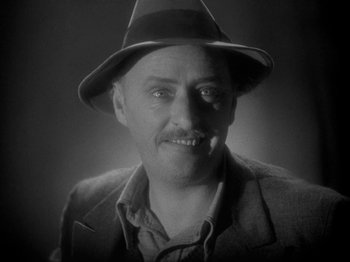 Movie still from “The Story of Temple Drake” (1933), directed by Stephen Roberts – An older man wearing a hat and a jacket; Close Up shot, High angle