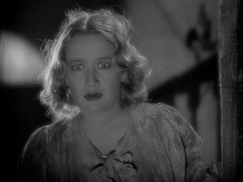 Movie still from “The Story of Temple Drake” (1933), directed by Stephen Roberts – A black - and - white photo of a woman in a dress; Close Up shot, Low angle