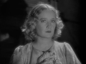 Movie still from “The Story of Temple Drake” (1933), directed by Stephen Roberts – An old black and white photo of a woman; Close Up shot, Low angle