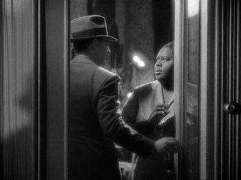 Movie still from “The Story of Temple Drake” (1933), directed by Stephen Roberts – A black and white photo of a man and a woman; Medium shot, Over the shoulder angle