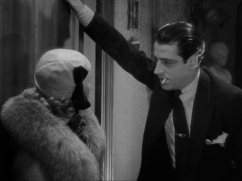 Movie still from “The Story of Temple Drake” (1933), directed by Stephen Roberts – A black and white photo of a man and a woman; Medium shot, Over the shoulder angle