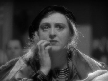 Movie still from “The Story of Temple Drake” (1933), directed by Stephen Roberts – A black - and - white photo of a woman in a hat; Close Up shot, Low angle