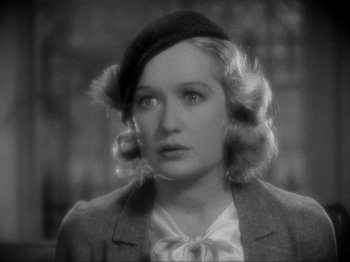 Movie still from “The Story of Temple Drake” (1933), directed by Stephen Roberts – A black and white photo of a woman in a hat; Close Up shot, High angle