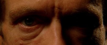 Movie still from “The Strange Color of Your Body's Tears” (2013), directed by Bruno Forzani – View of a man's eyes; Extreme Close Up shot, Overhead angle