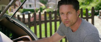 Movie still from “The Strangers: Prey at Night” (2018), directed by Johannes Roberts – A person sitting in a car; Close Up shot, Over the shoulder angle