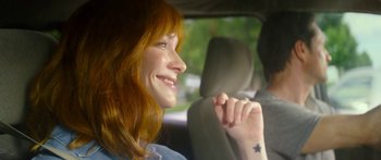 Movie still from “The Strangers: Prey at Night” (2018), directed by Johannes Roberts – A woman sitting in the back seat of a car; Close Up shot, Over the shoulder angle