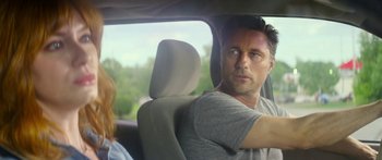 Movie still from “The Strangers: Prey at Night” (2018), directed by Johannes Roberts – A man sitting in the back seat of a car; Close Up shot, Over the shoulder angle