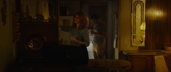 Movie still from “The Strangers: Prey at Night” (2018), directed by Johannes Roberts – A man and a woman in a kitchen; Medium shot, Over the shoulder angle