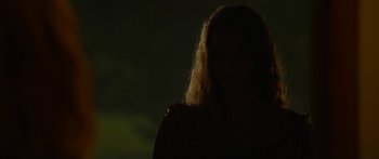 Movie still from “The Strangers: Prey at Night” (2018), directed by Johannes Roberts – A woman with blonde hair standing in the dark; Close Up shot, Over the shoulder angle