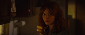 Movie still from “The Strangers: Prey at Night” (2018), directed by Johannes Roberts – A person with long hair; Close Up shot, Over the shoulder angle