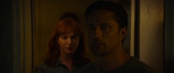 Movie still from “The Strangers: Prey at Night” (2018), directed by Johannes Roberts – A man and a woman standing next to each other in a room; Close Up shot, Over the shoulder angle