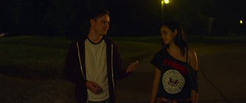 Movie still from “The Strangers: Prey at Night” (2018), directed by Johannes Roberts – A man and a woman standing next to each other on a street; Medium shot, Over the shoulder angle