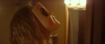 Movie still from “The Strangers: Prey at Night” (2018), directed by Johannes Roberts – A woman with a mask on her face looking up; Close Up shot, Low angle