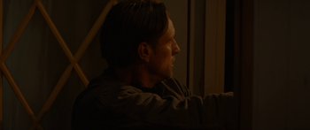 Movie still from “The Strangers: Prey at Night” (2018), directed by Johannes Roberts – A person sitting in a chair; Close Up shot, Over the shoulder angle