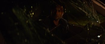 Movie still from “The Strangers: Prey at Night” (2018), directed by Johannes Roberts – A man sitting in a car in the dark; Close Up shot, Over the shoulder angle