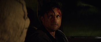 Movie still from “The Strangers: Prey at Night” (2018), directed by Johannes Roberts – A person with a face covered in blood; Close Up shot, Over the shoulder angle