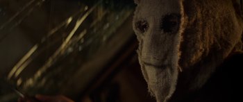 Movie still from “The Strangers: Prey at Night” (2018), directed by Johannes Roberts – The face of a knitted creature; Close Up shot, Over the shoulder angle