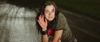 Movie still from “The Strangers: Prey at Night” (2018), directed by Johannes Roberts – A woman with blood all over her face and arm; Medium shot, High angle