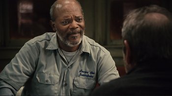 Movie still from “The Sunset Limited” (2011), directed by Tommy Lee Jones – An older man is talking to a younger man; Close Up shot, Over the shoulder angle