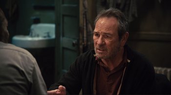 Movie still from “The Sunset Limited” (2011), directed by Tommy Lee Jones – An older man talking to someone in a bathroom; Close Up shot, Over the shoulder angle
