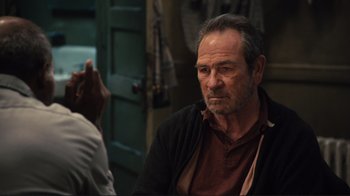 Movie still from “The Sunset Limited” (2011), directed by Tommy Lee Jones – An older man sitting in front of a mirror; Close Up shot, Over the shoulder angle
