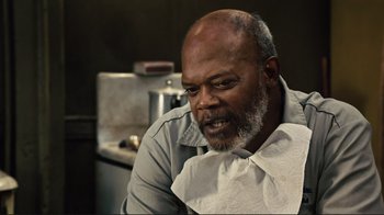 Movie still from “The Sunset Limited” (2011), directed by Tommy Lee Jones – An older man sitting in front of a sink; Close Up shot, Over the shoulder angle