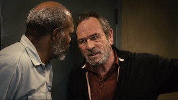 Movie still from “The Sunset Limited” (2011), directed by Tommy Lee Jones – A man with a goatee talking to another man with a goatee; Close Up shot, Over the shoulder angle