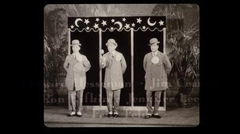 Movie still from “The Sunshine Boys” (1975), directed by Herbert Ross – A group of men standing next to each other on a stage; Wide shot, Low angle