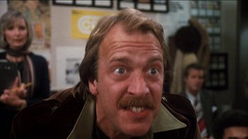 Movie still from “The Sunshine Boys” (1975), directed by Herbert Ross – A person with a mustache; Close Up shot, Low angle