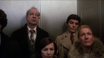 Movie still from “The Sunshine Boys” (1975), directed by Herbert Ross – A group of people standing next to each other in a room; Medium shot, Low angle