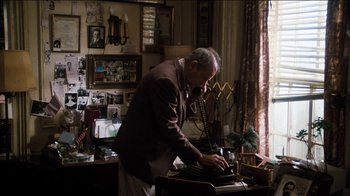 Movie still from “The Sunshine Boys” (1975), directed by Herbert Ross – An older man using an old fashioned telephone; Medium shot, High angle