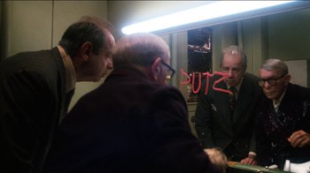 Movie still from “The Sunshine Boys” (1975), directed by Herbert Ross – A group of men standing in front of a mirror; Medium shot, Over the shoulder angle