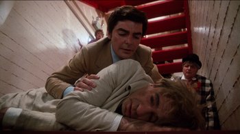Movie still from “The Sunshine Boys” (1975), directed by Herbert Ross – A man in a brown suit and a man in a white suit and a man in a tan suit and a man in a white shirt and a; Medium shot, Overhead angle