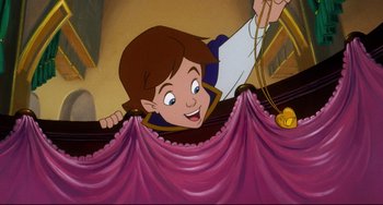 Movie still from “The Swan Princess” (1994), directed by Richard Rich – A cartoon of a boy hanging from a curtain; Medium shot, High angle
