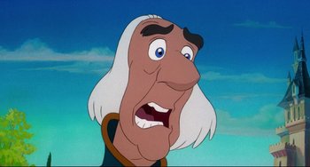 Movie still from “The Swan Princess” (1994), directed by Richard Rich – An old man with long white hair and a beard; Close Up shot, Over the shoulder angle