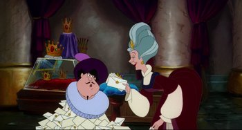 Movie still from “The Swan Princess” (1994), directed by Richard Rich – Two women are holding a cake in front of them; Medium shot, Over the shoulder angle