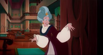 Movie still from “The Swan Princess” (1994), directed by Richard Rich – A woman in a blue and white dress is standing in front of a bookshelf; Medium shot, Over the shoulder angle