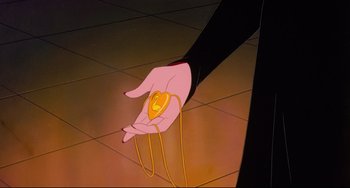 Movie still from “The Swan Princess” (1994), directed by Richard Rich – An animated hand holding an ear bud in the palm of someones hand; Extreme Close Up shot, High angle