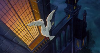 Movie still from “The Swan Princess” (1994), directed by Richard Rich – An animated bird flying over a building at night; Extreme Wide shot, High angle