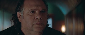 Movie still from “The Sweet Hereafter” (1997), directed by Atom Egoyan – A man's face in a dark room; Close Up shot, Low angle