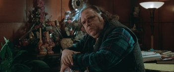 Movie still from “The Sweet Hereafter” (1997), directed by Atom Egoyan – A man sitting in front of a christmas tree; Close Up shot, Low angle