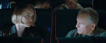 Movie still from “The Sweet Hereafter” (1997), directed by Atom Egoyan – A group of people sitting in a car looking at a laptop computer; Close Up shot, Over the shoulder angle